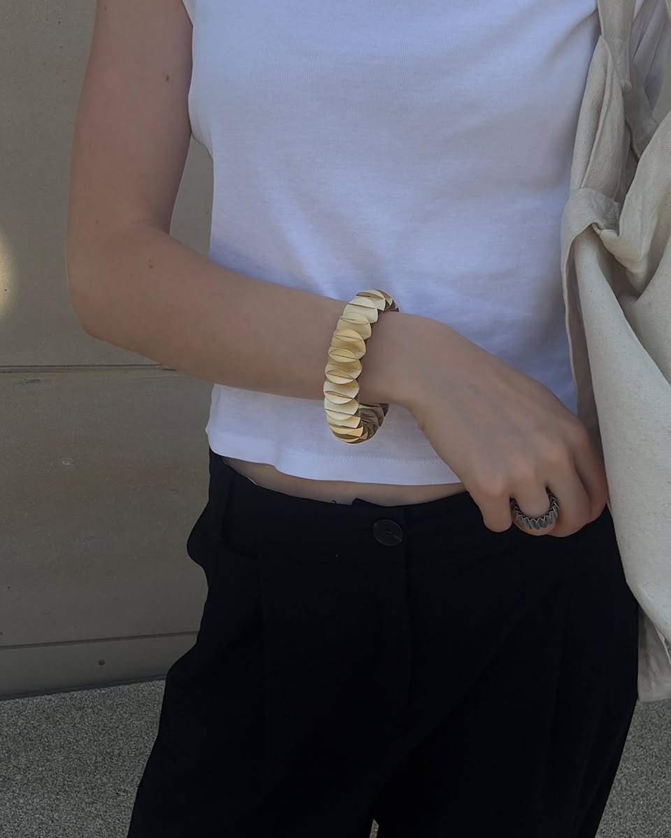 Another perspective of a Niessing Phoenix jewelry item, revealing its form