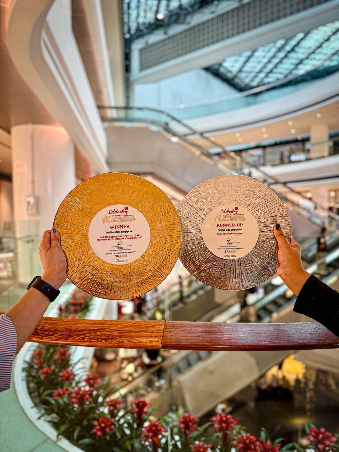 Raffles City Singapore team celebrating their recent accolades at the SRA Retail Awards