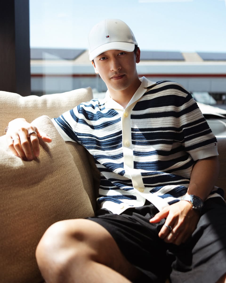 Zhou Guanyu wearing Tommy Hilfiger striped polo and cap