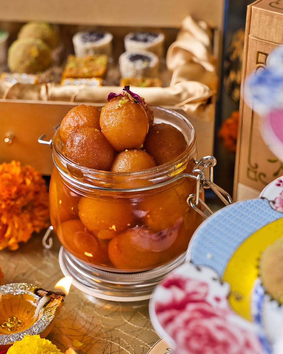 Assorted Indian sweets artfully displayed on a platter, ready for celebration.