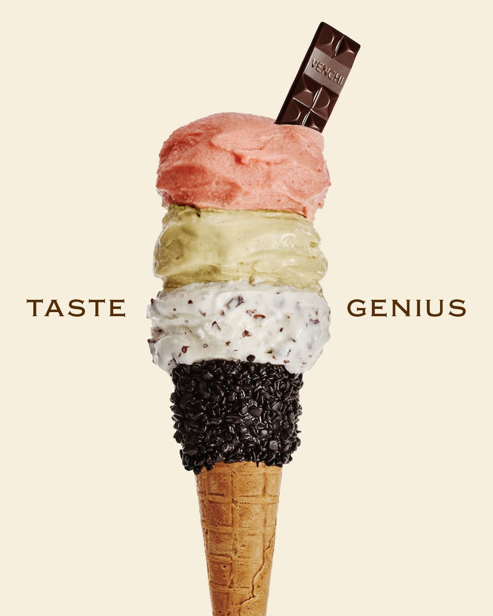 Venchi gelato cone with four scoops topped with chocolate bar