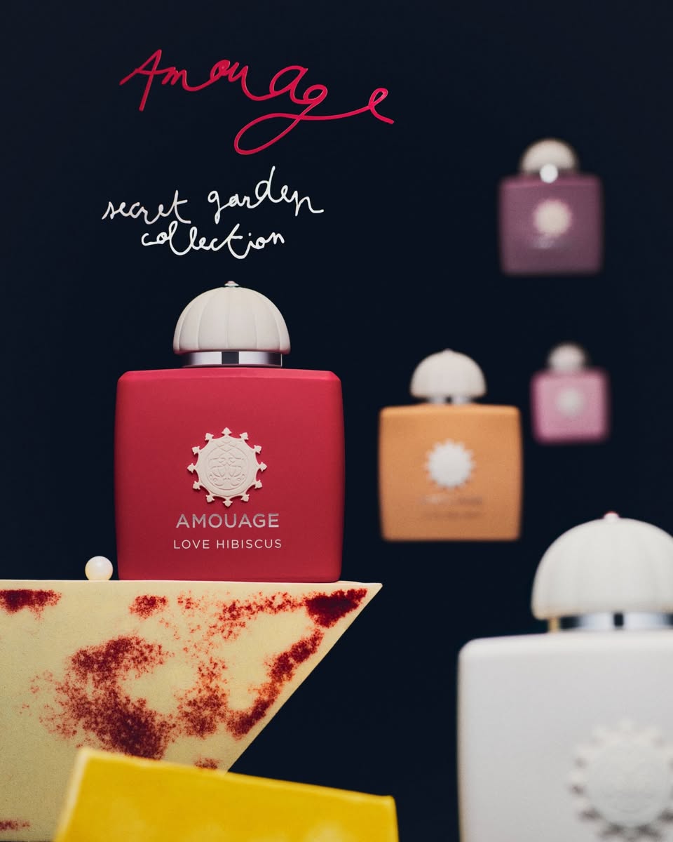 Amouage Secret Garden Collection perfume bottles including Love Hibiscus