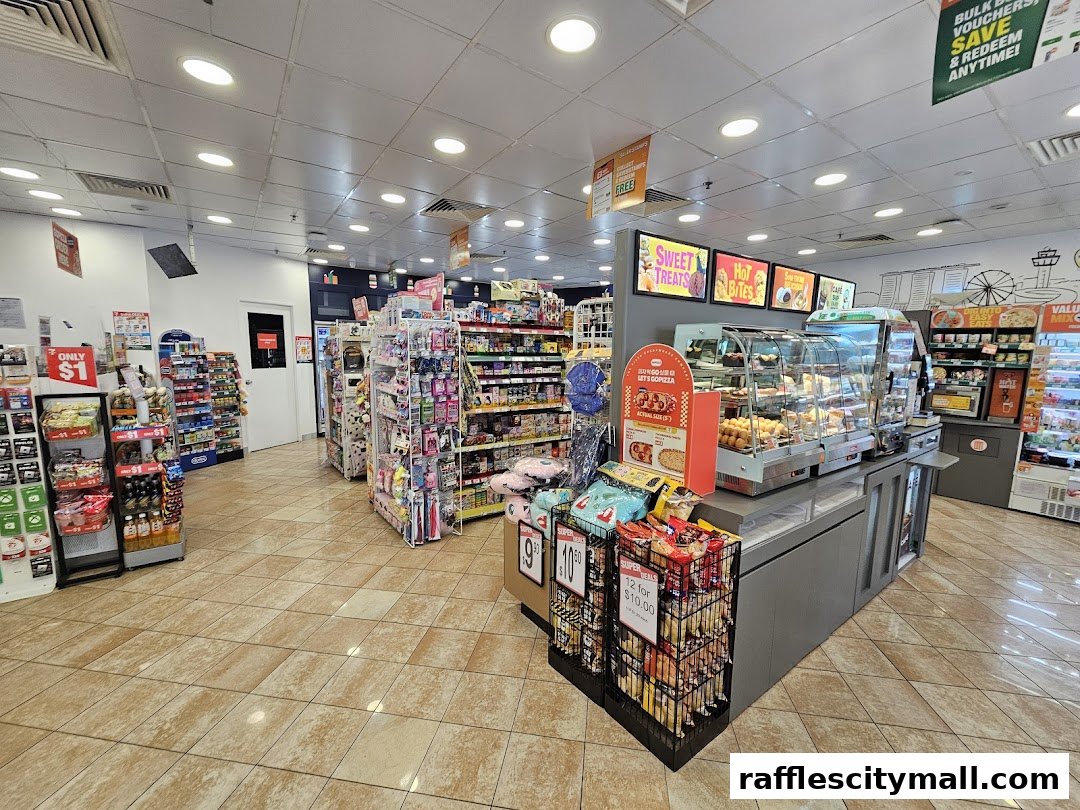 Interior view of a 7-Eleven store showcasing a variety of snacks, drinks, and a food display.