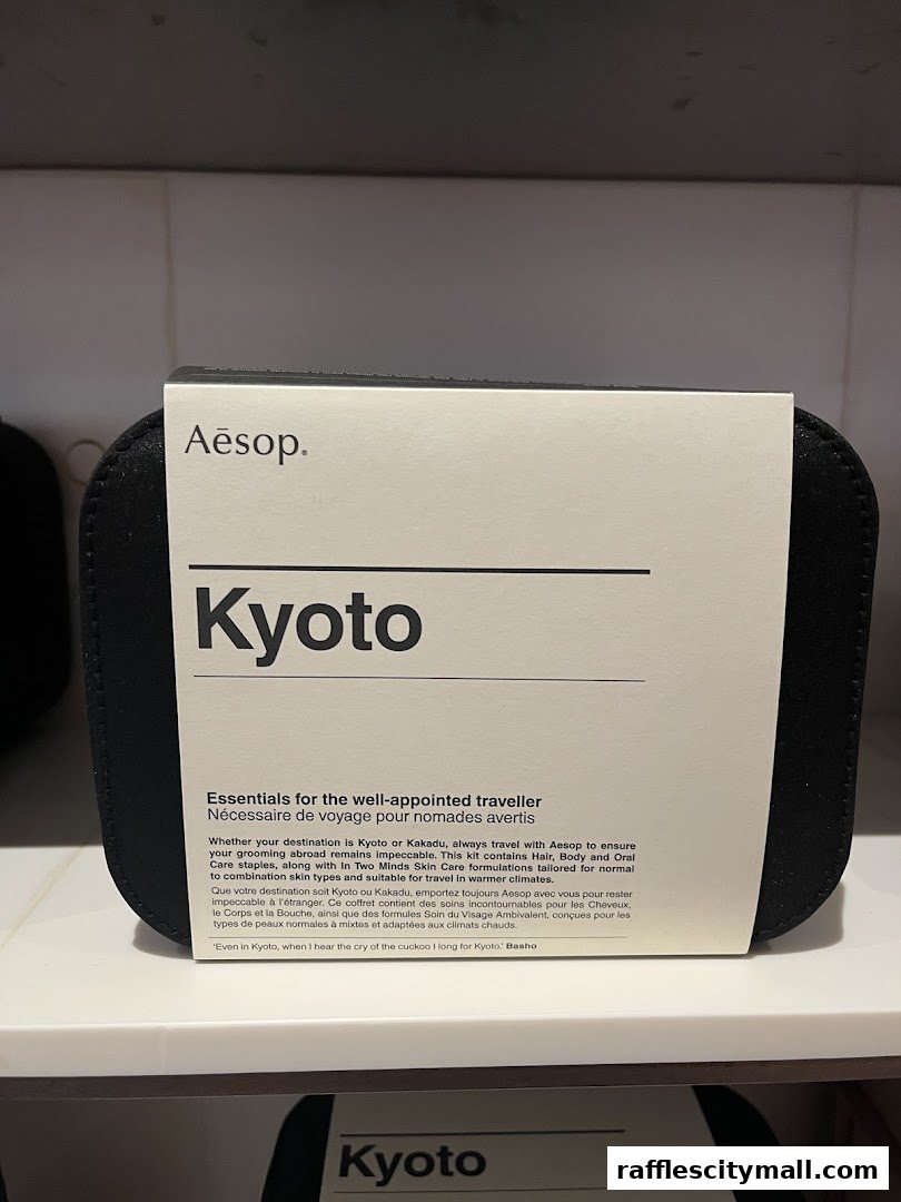 A black travel kit from Aesop featuring the 'Kyoto' collection.