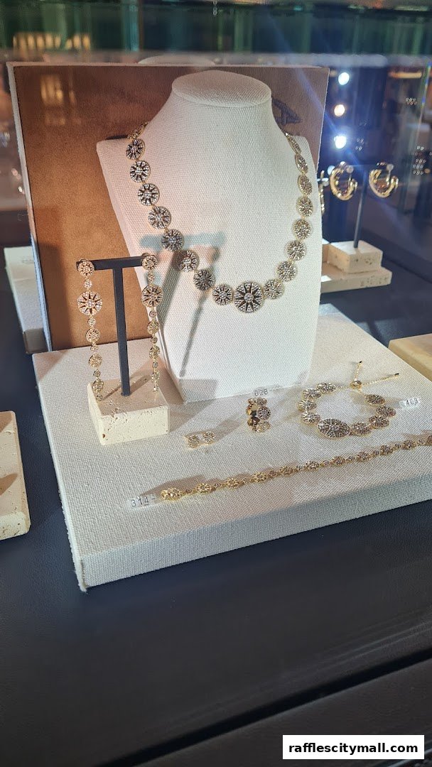 Display of elegant gold jewelry with intricate designs, including necklaces, earrings, bracelets, and rings.