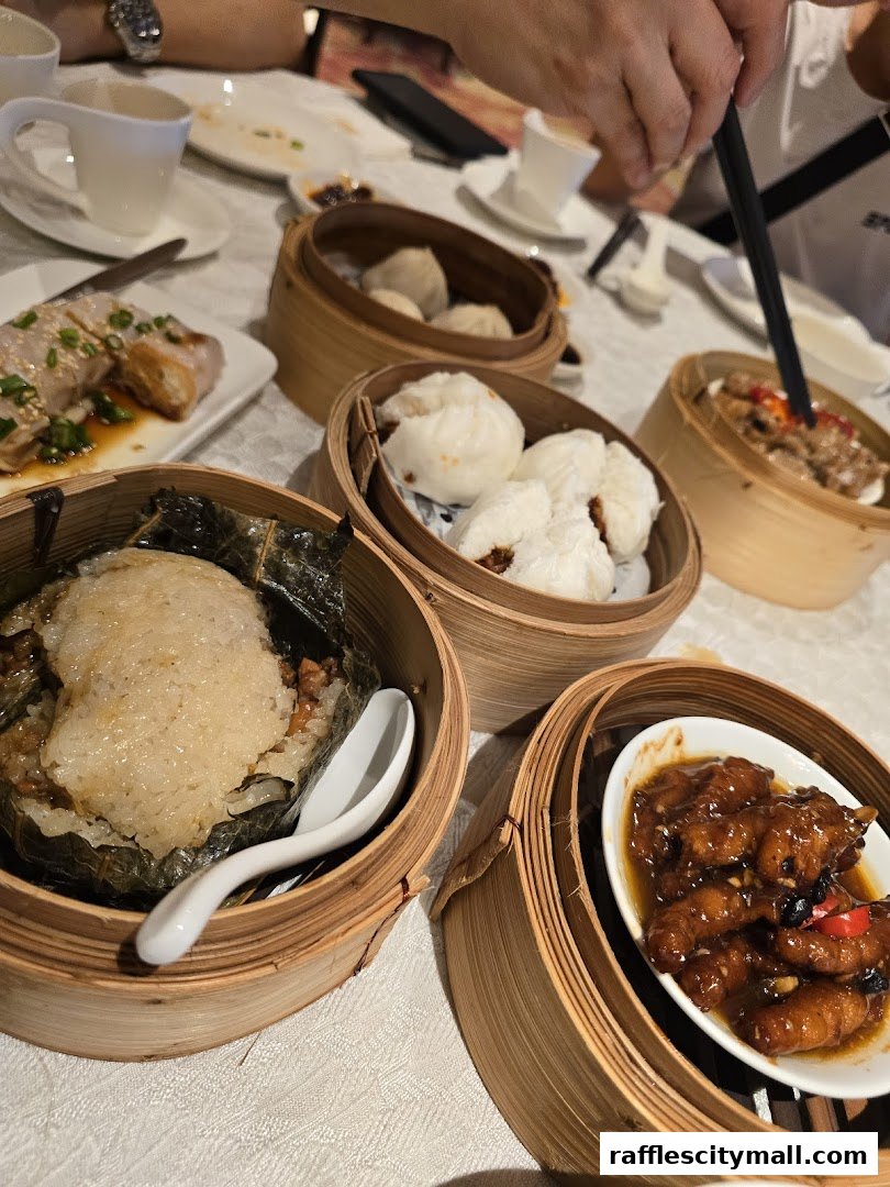 A table laden with various delicious dim sum dishes served in bamboo steamers.
