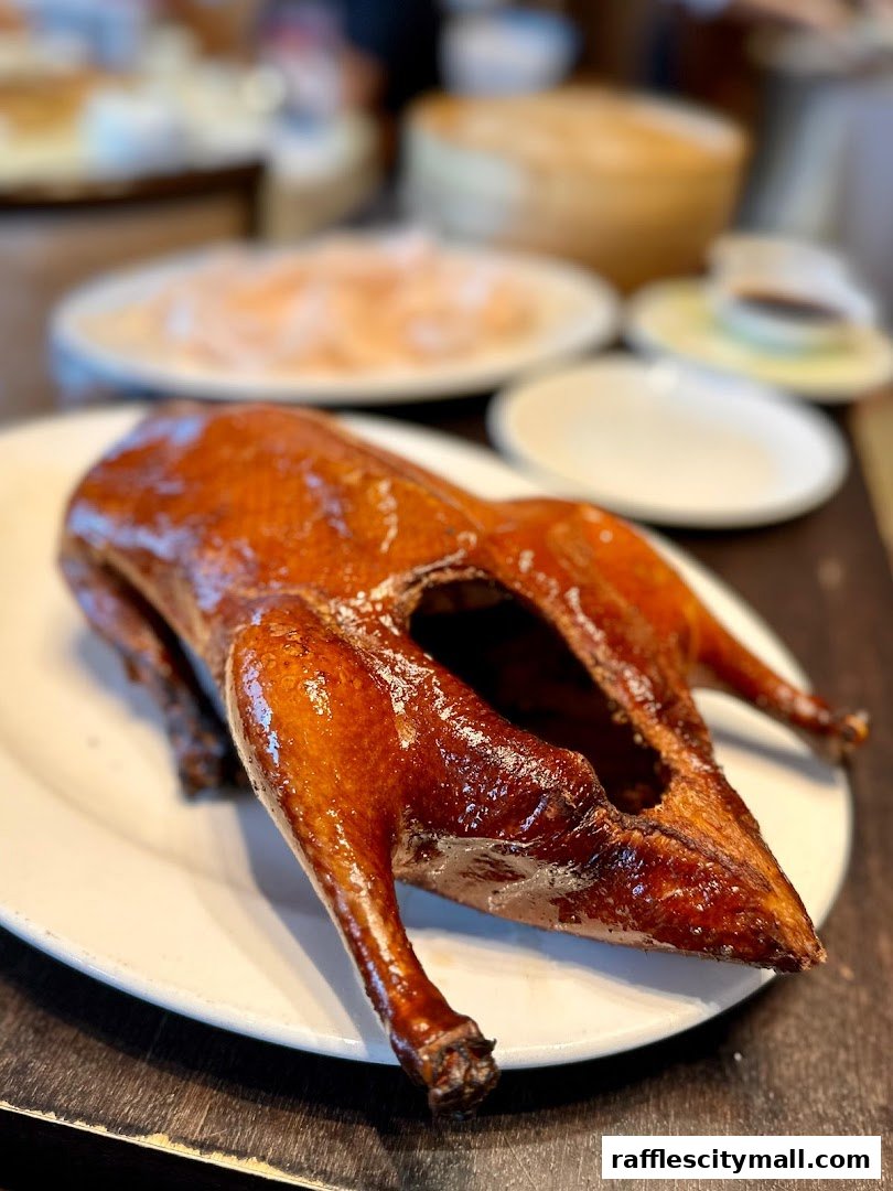 A succulent, roasted duck is presented on a white plate, ready to be enjoyed.