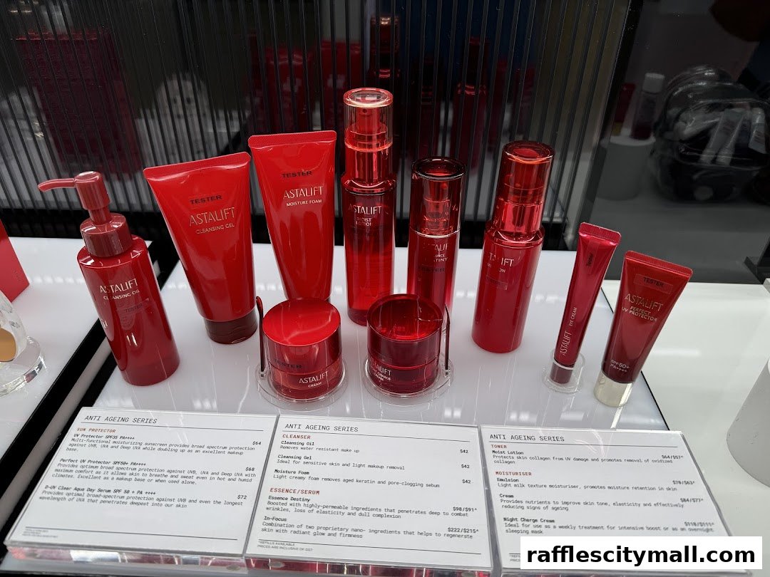 A display of Astalift skincare products, featuring red packaging and product information cards.