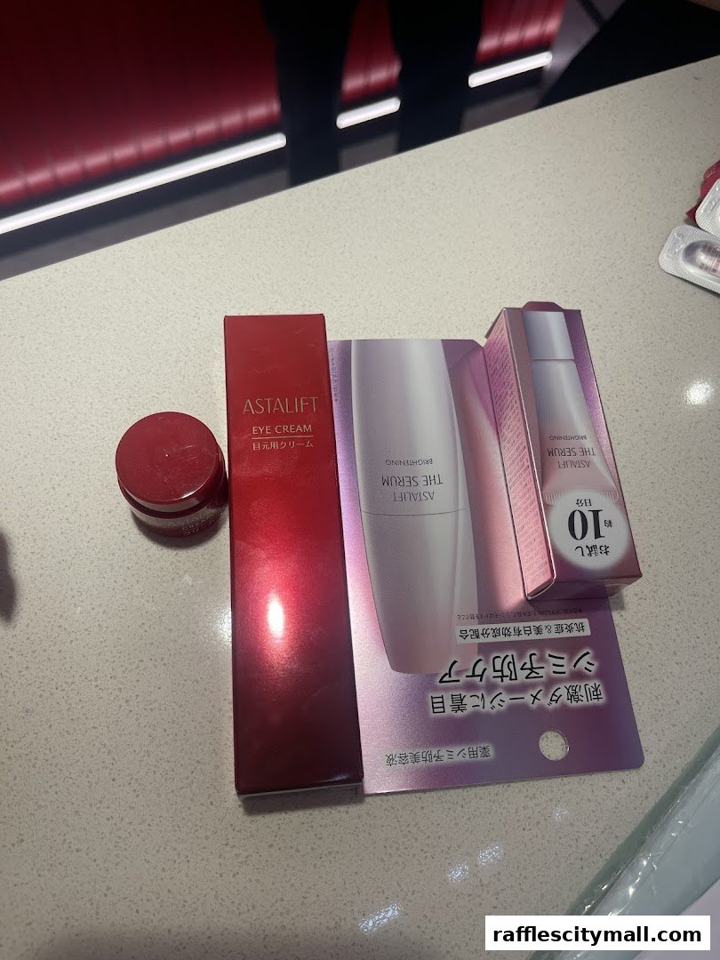 Astalift skincare products including eye cream and serum are displayed.