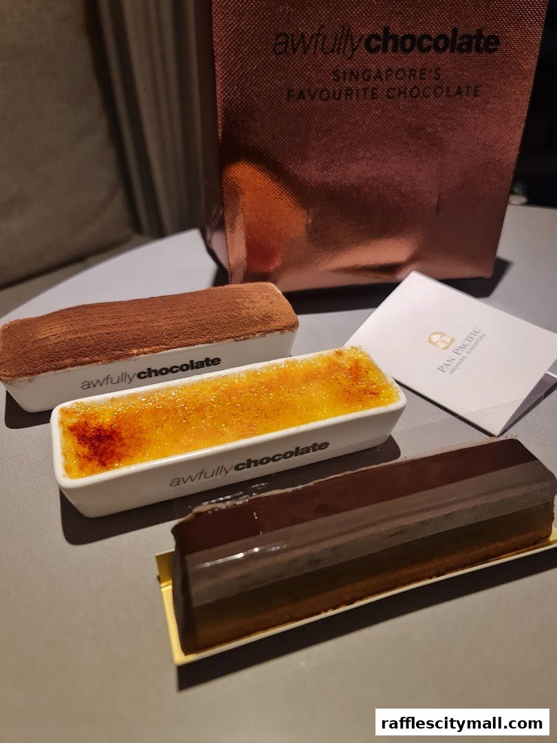Three delicious desserts from Awfully Chocolate, including a tiramisu, creme brulee, and chocolate cake.
