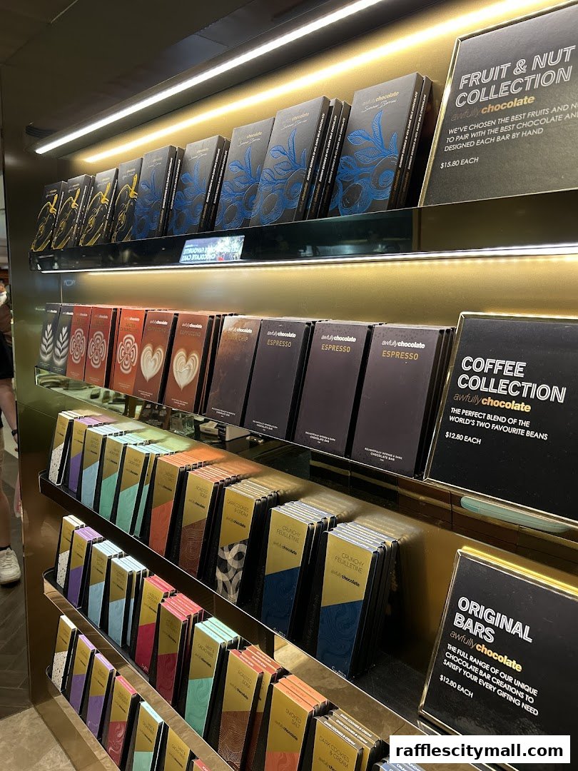 Shelves filled with various Awfully Chocolate bars, neatly displayed and categorized.