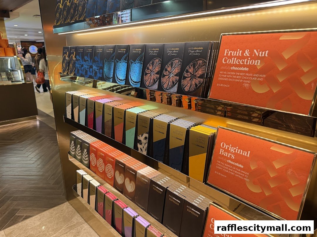 Display shelves filled with various chocolate bars and collections from Awfully Chocolate.