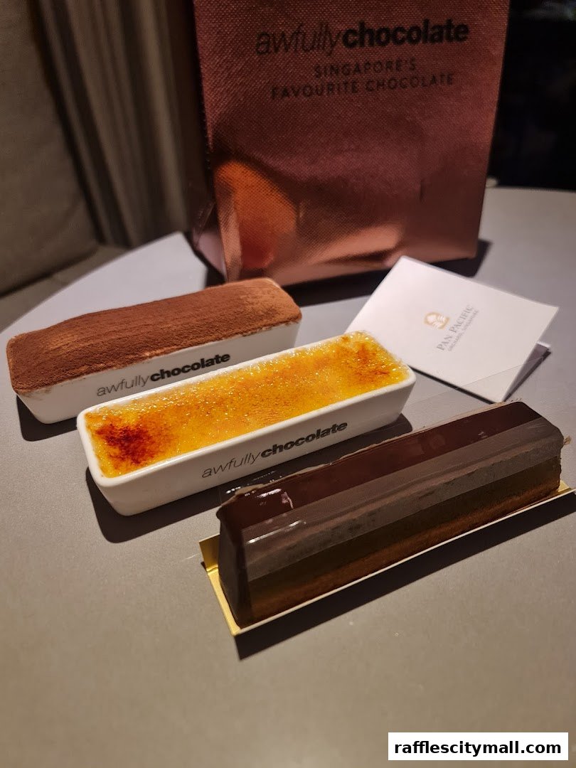 Three delicious desserts from Awfully Chocolate, including a tiramisu, creme brulee, and chocolate cake.