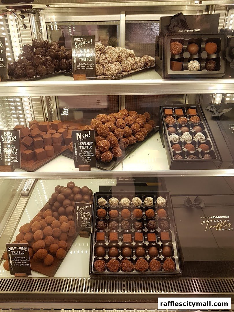 A display case filled with various types of gourmet chocolates and truffles.