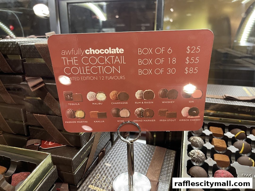 A sign displays Awfully Chocolate's Cocktail Collection with prices and 12 flavor options.