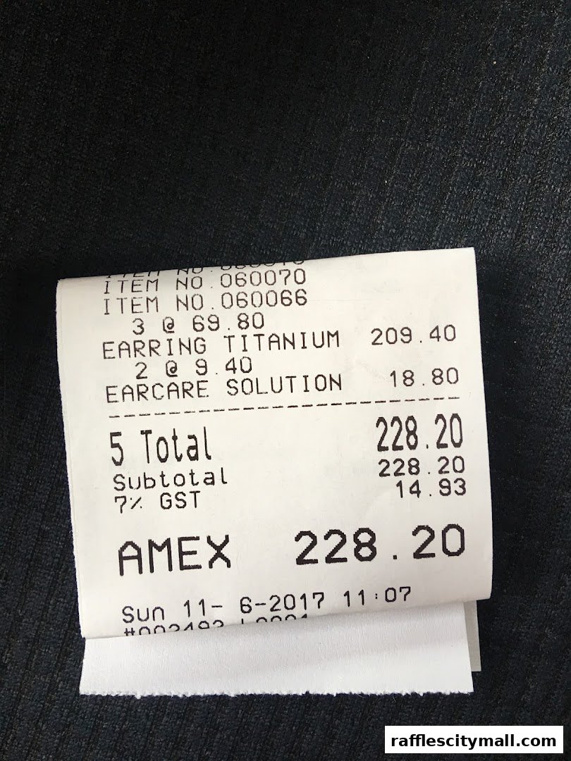 A receipt from Bdazzle showing purchases of earrings and ear care solution.