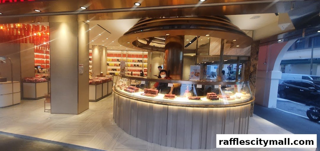 Interior view of a Bee Cheng Hiang shop with display cases filled with bak kwa.