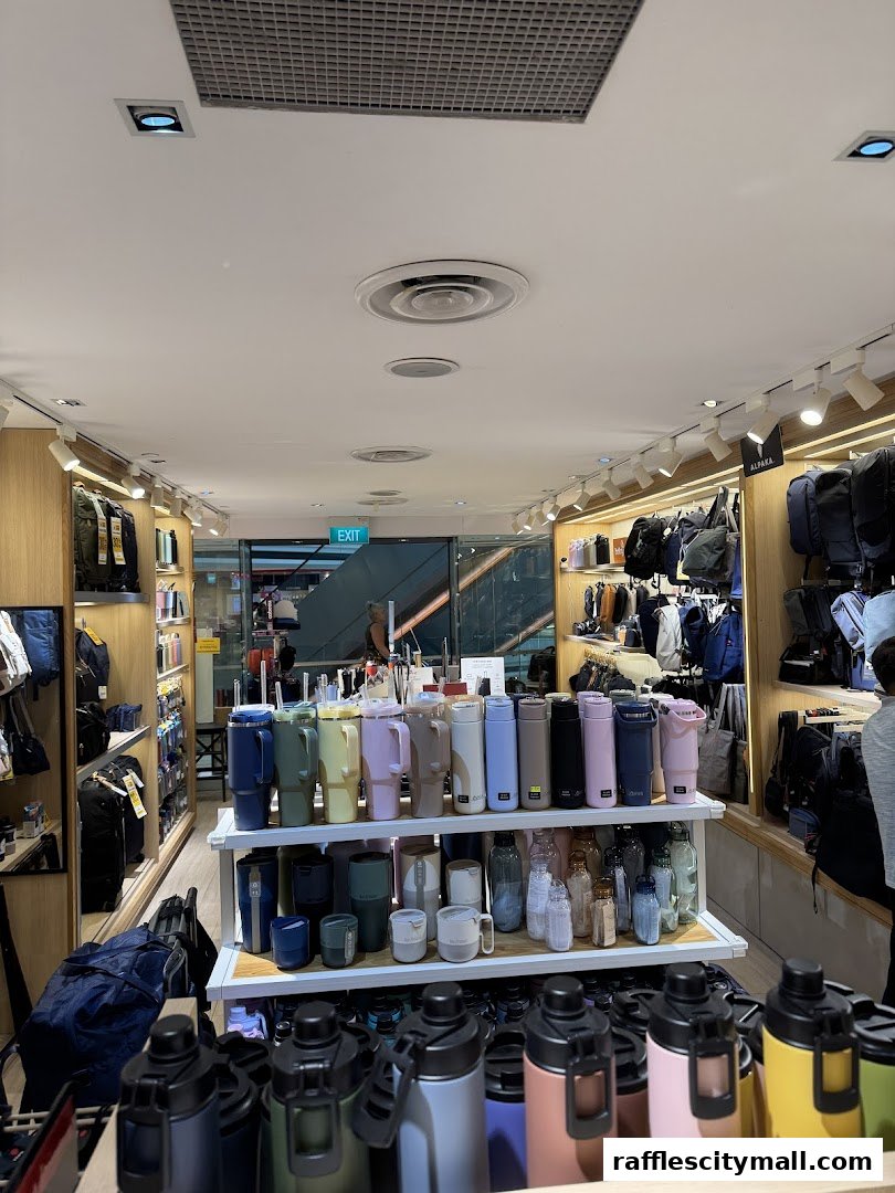 Interior view of a shop displaying a wide variety of water bottles and bags.