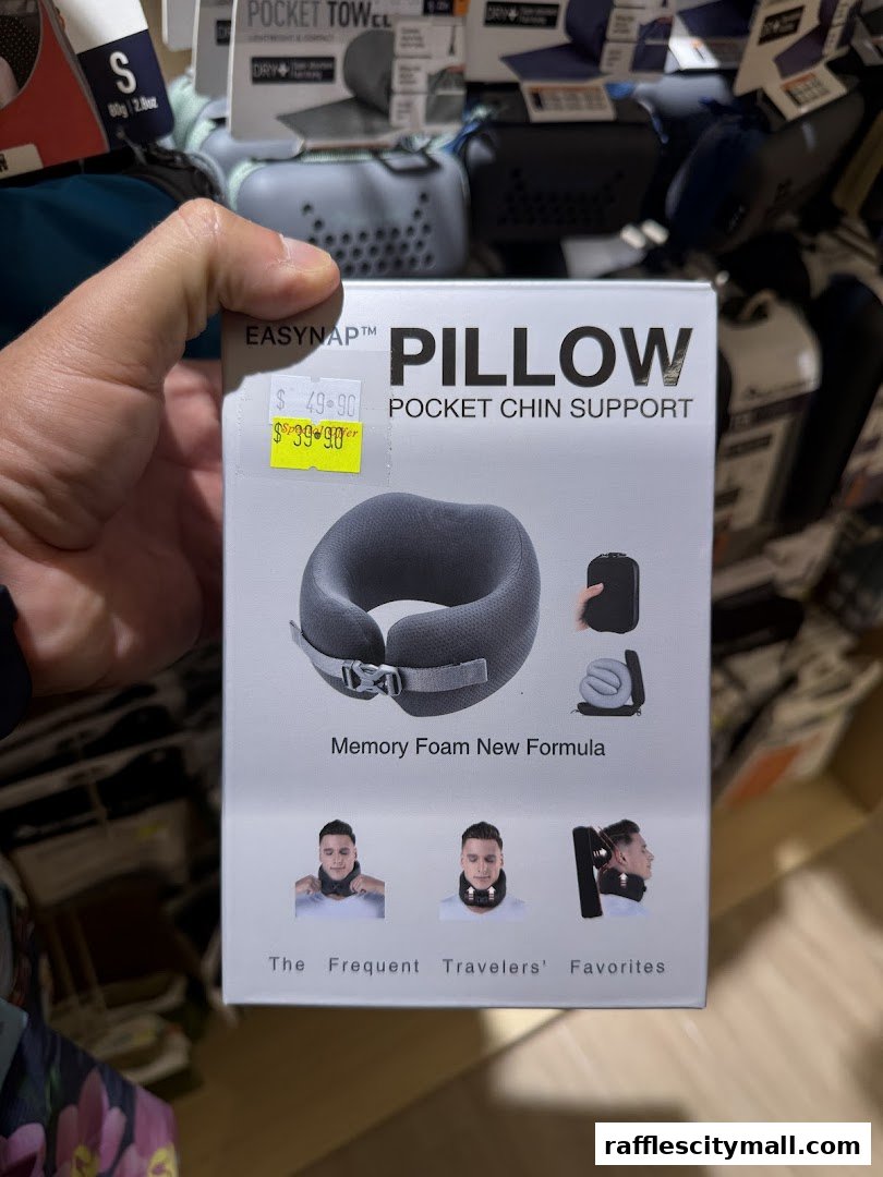 A hand holds a box for an Easynap pillow with pocket chin support.