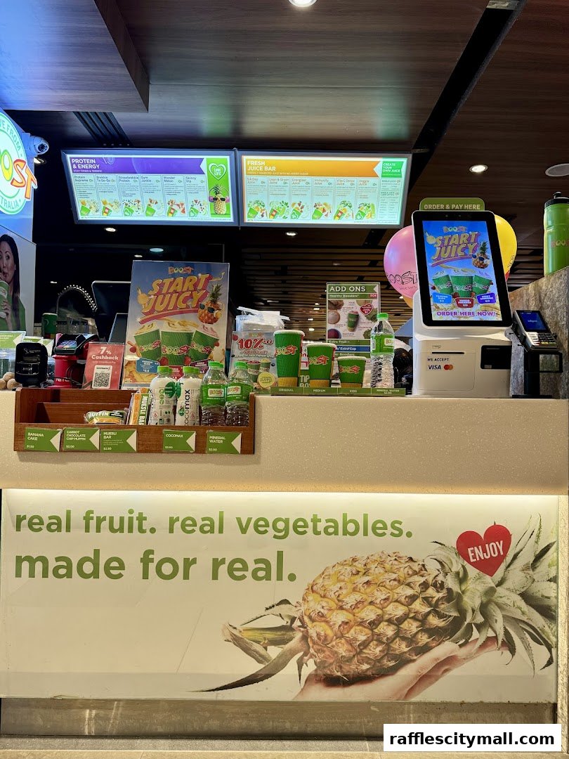 A Boost Juice counter with menus, products, and a digital ordering screen.