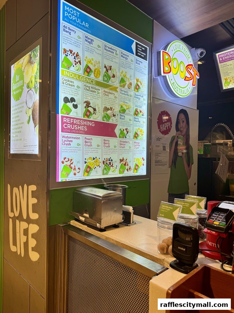 A brightly lit menu board showcasing popular smoothies and crushes at Boost Juice.