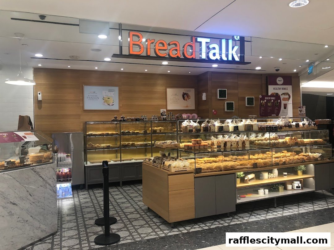 A BreadTalk bakery shop with a wide display of fresh bread, pastries, and cakes.