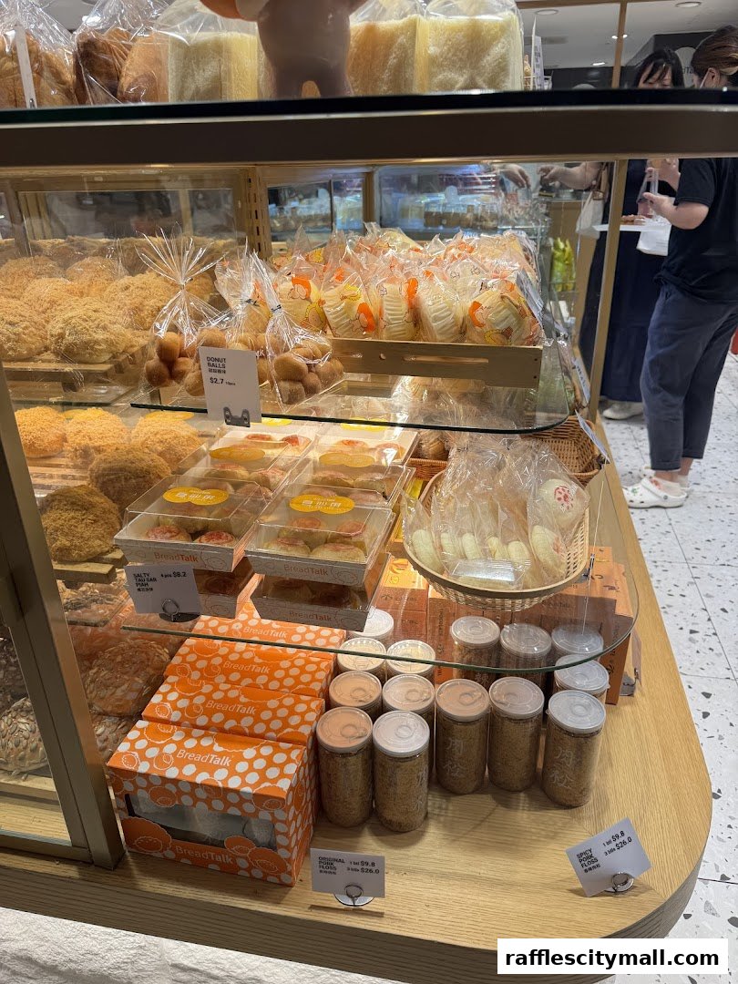 A display of various baked goods and packaged snacks at BreadTalk.