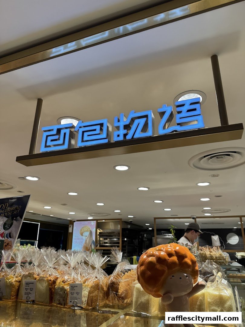 A bakery display with various breads and a decorative figure.