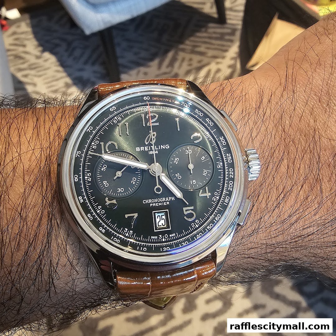 A close-up shot of a Breitling Chronograph Premier watch on a person's wrist.