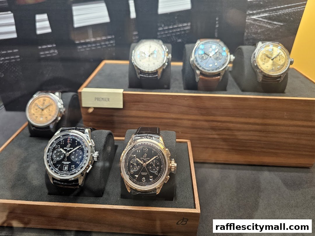 A display of Breitling watches, showcasing various models with different dial colors and strap options.