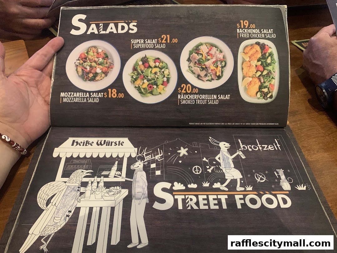 A menu featuring salads and street food with illustrative drawings.