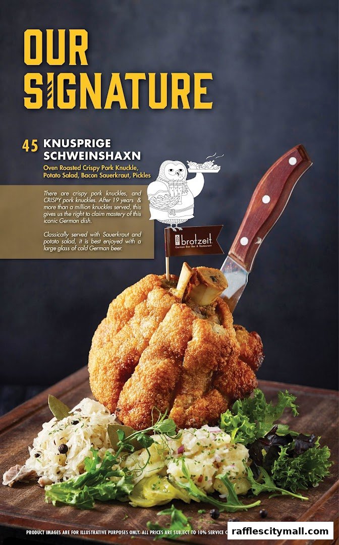 A signature German pork knuckle dish served with sauerkraut, potato salad, and pickles.