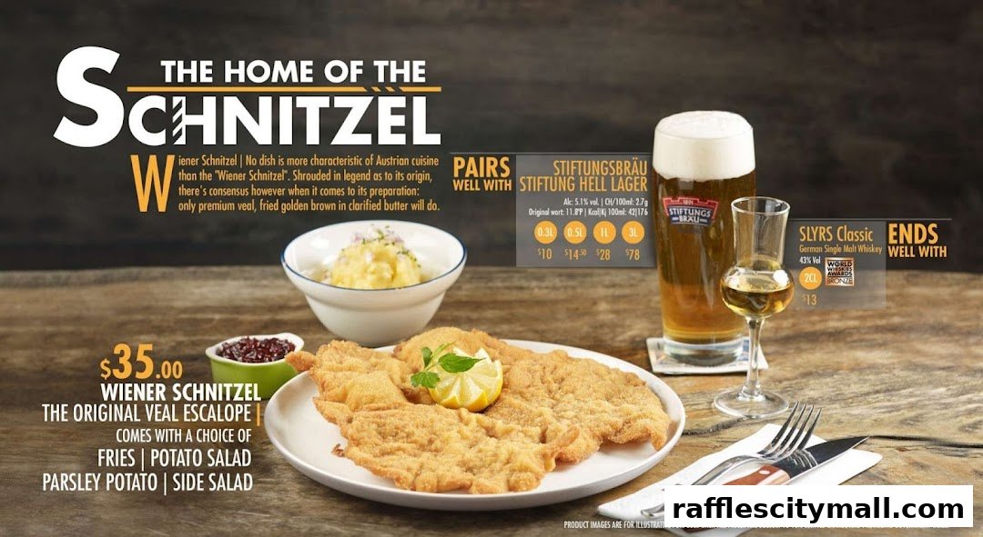 A delicious Wiener Schnitzel meal with a side of potato salad and a beer.