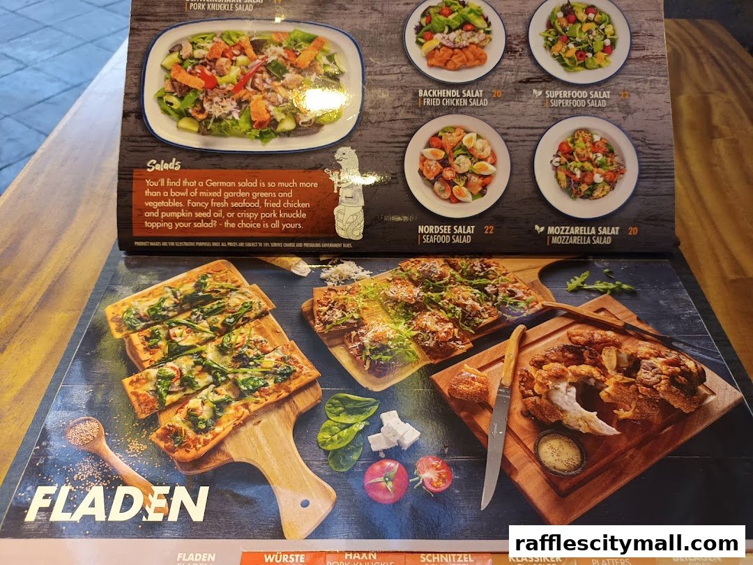 A menu featuring German salads, fladen, and pork knuckle with prices.