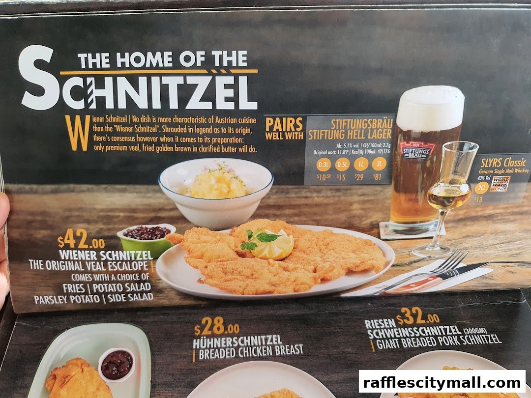 A menu featuring Wiener Schnitzel, beer, and whiskey, highlighting Austrian cuisine.