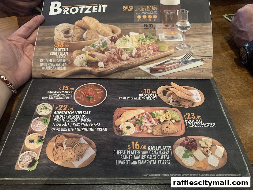 A menu from Brotzeit Raffles City featuring various German dishes and platters.