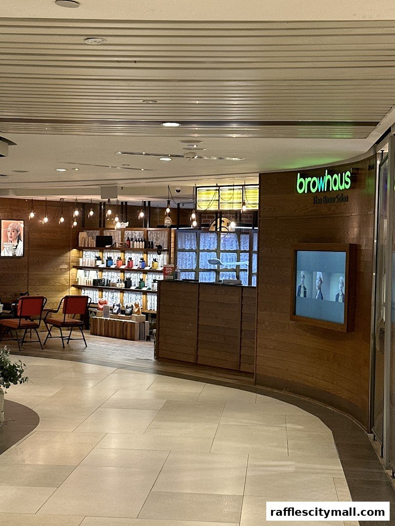The Browhaus Raffles City shop front with warm wood accents and product displays.