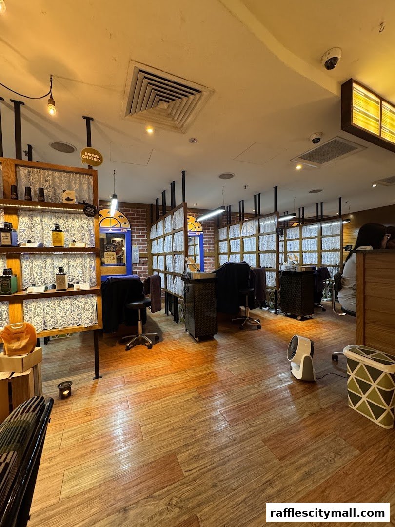 Interior view of a beauty salon with workstations and product displays.