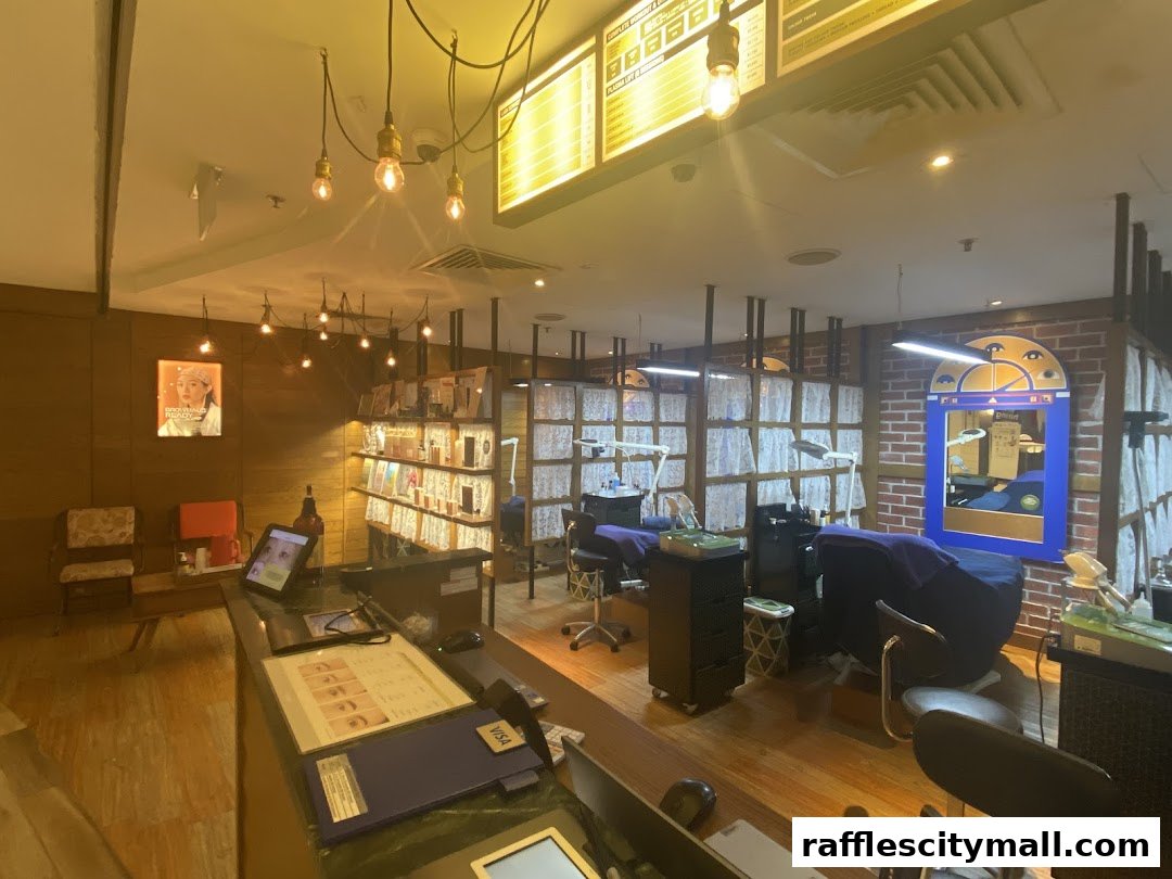 Interior view of a beauty salon with treatment beds, product displays, and a reception desk.