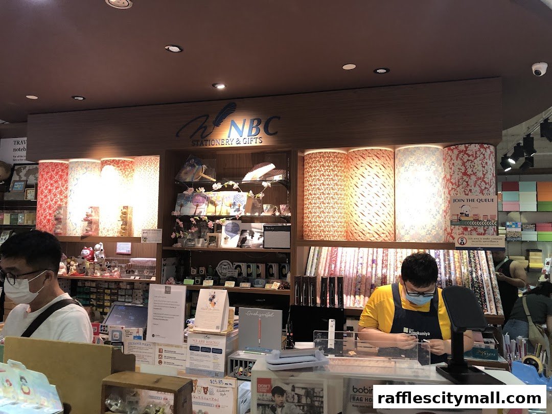 Interior of a stationery and gifts shop with displays of patterned paper and various merchandise.