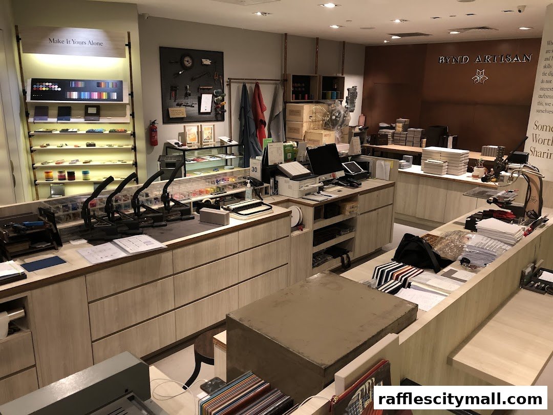 Interior view of a well-lit retail store with displays of leather goods and crafting tools.