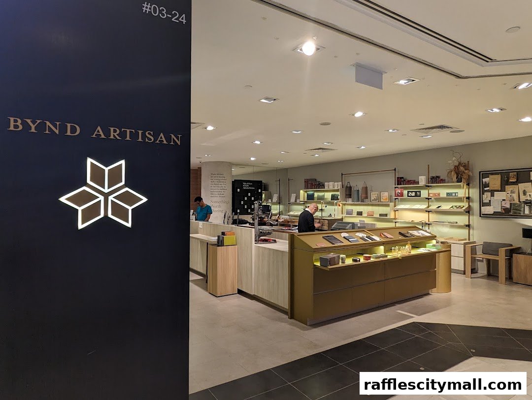 Interior view of Bynd Artisan Raffles City Atelier shop showcasing leather goods and stationery.