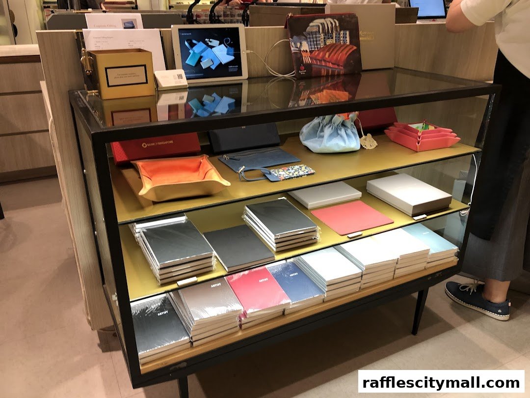 A display cabinet filled with notebooks, pouches, and small leather goods from Bynd Artisan.