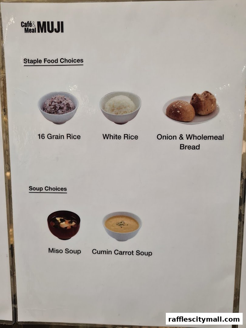A menu from CafeMeal MUJI Raffles City showing staple food and soup choices.