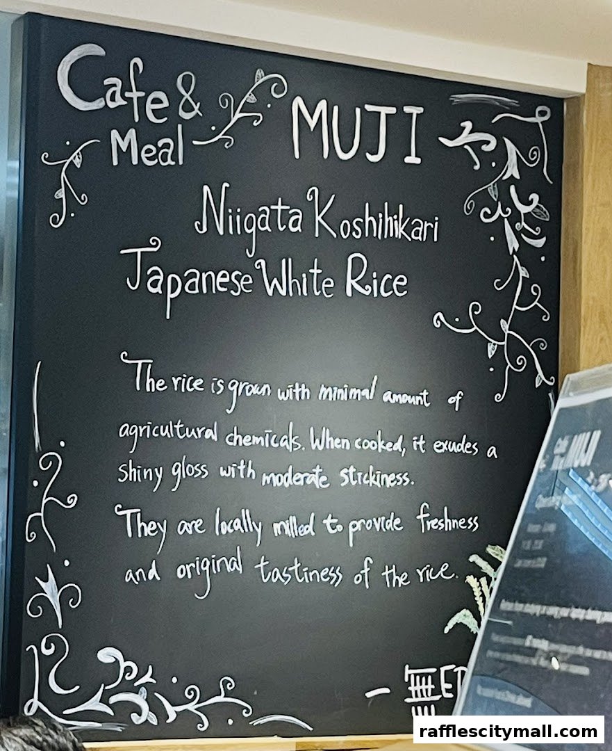 A chalkboard menu at Cafe & Meal MUJI featuring Niigata Koshikari Japanese White Rice.