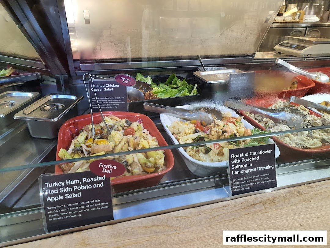 A display of fresh deli salads and prepared meals in a refrigerated case.