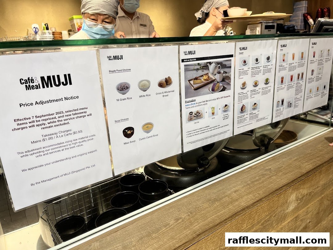 A display of menus and notices at the counter of CafeMeal MUJI Raffles City.