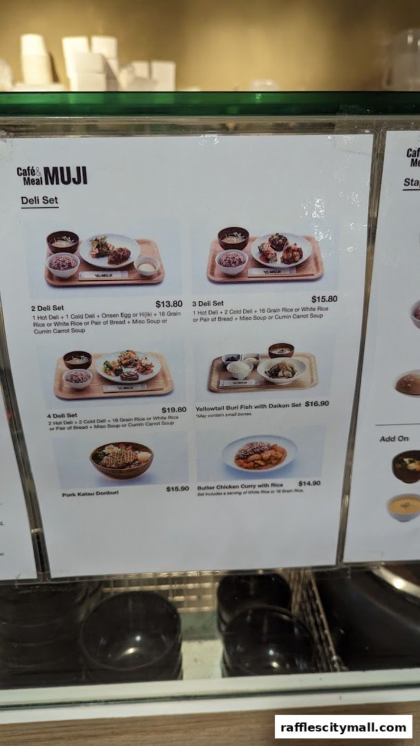 A menu display for CafeMeal MUJI featuring various deli sets and donburi.