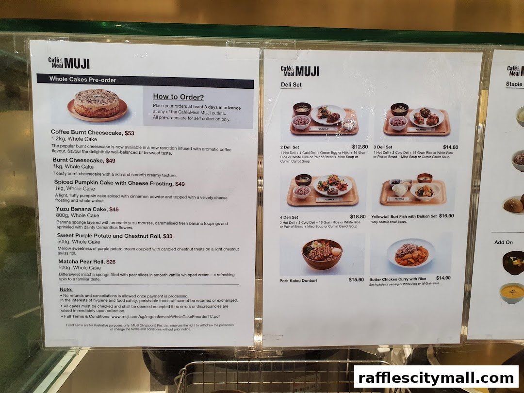 A menu display for Cafe MUJI featuring whole cakes and deli sets.