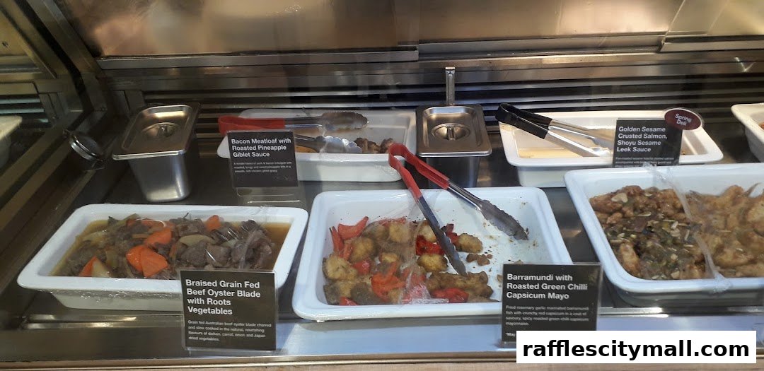 A display of various prepared dishes in a food service counter.